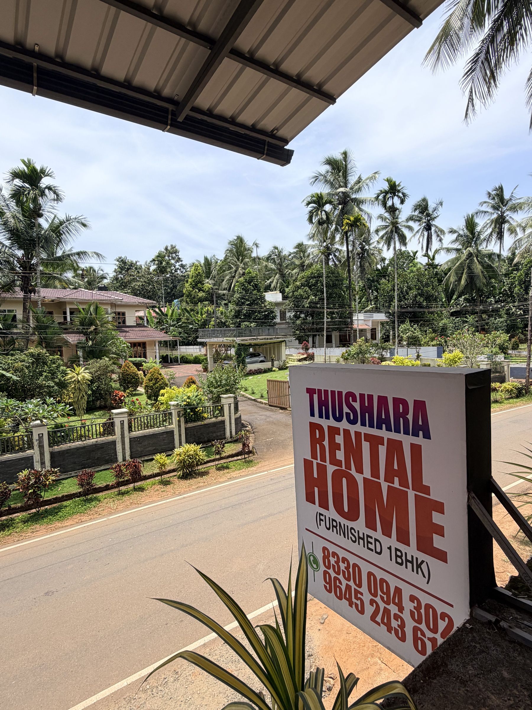 Thushara Homestay sign on the Karuvanchal–Velladu road, Alakode